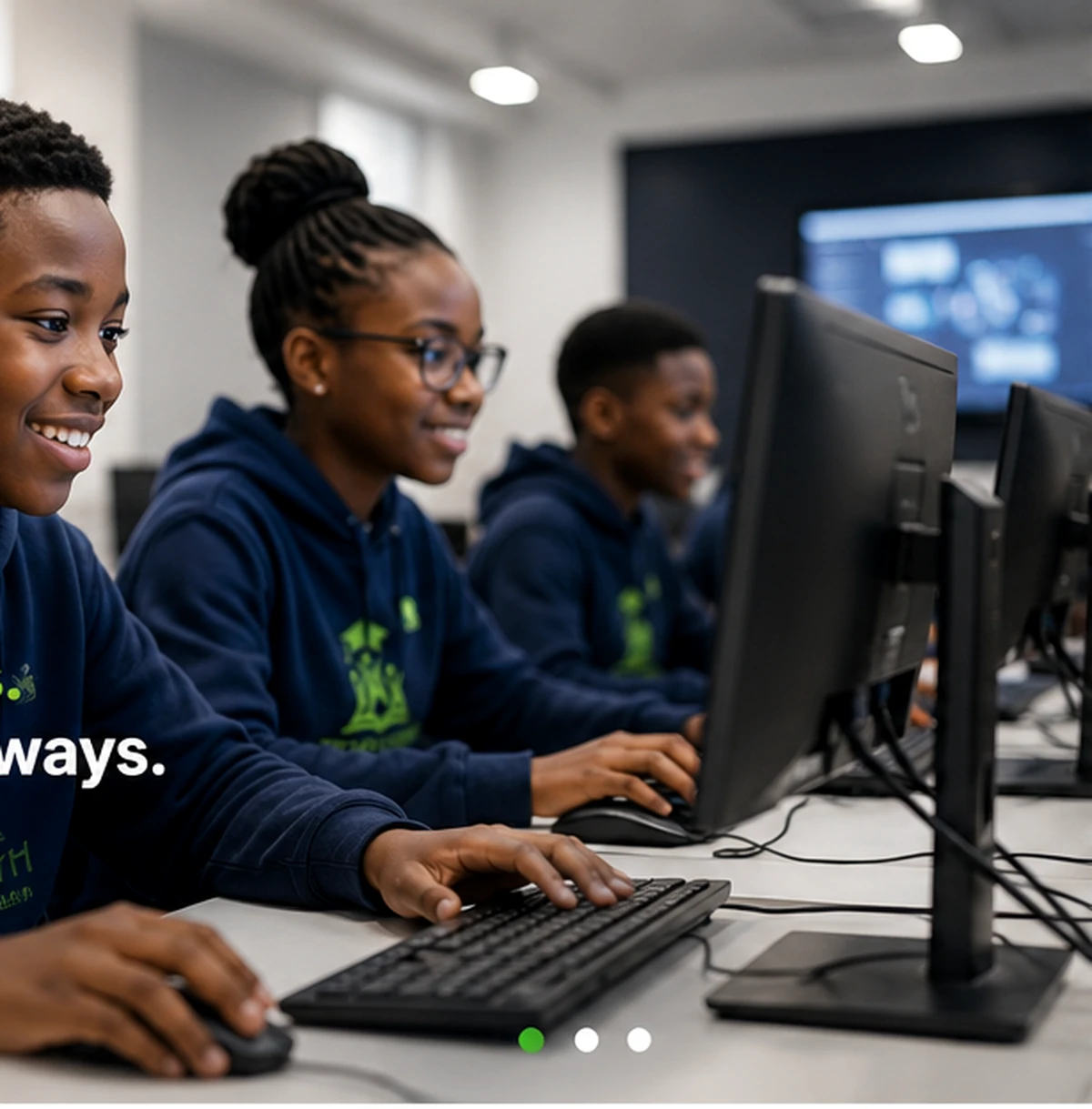 Students learning practical technology skills in a computer lab